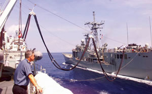 HMCS Protecteur refueling an RN frigate off East Timor in 1999.