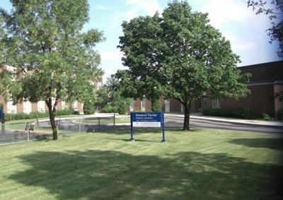 School, sign and surroundings