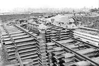 Bolting the rails to the ties. Canadian Railway Troops in France.