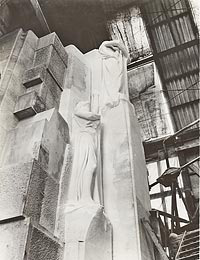 The finished statues of Justice and Faith are waiting for Hope to be carved.