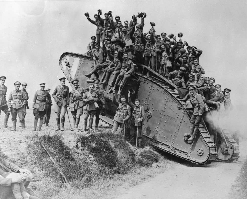 Happy Canadian soldiers atop a tank after the Battle of Amiens in August 1918.