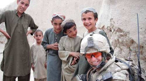 Captain Collette with local Afghan children in 2010