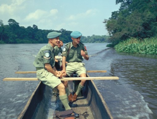 Two Canadian peacekeepers travelling on the Congo River in 1961. 