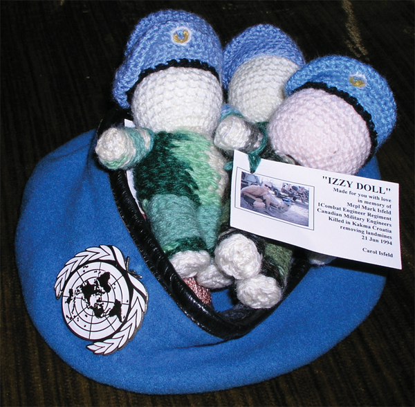 Izzy Dolls wear the UN blue beret.