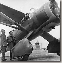 Ray LaBrosse standing next to an old Lysander aircraft