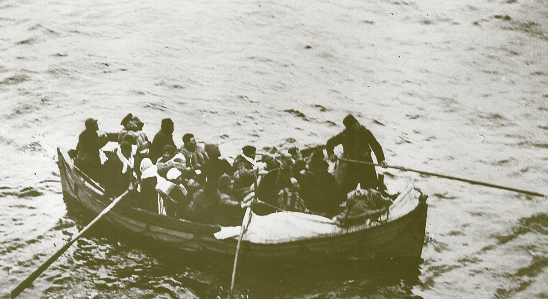 Boat load of seamen from torpedoed merchant ship alongside HMCS Red Deer off Halifax