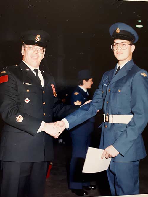 Warrant Officer Jean-Charles Cotton presents his son, Private Ghislain Cotton