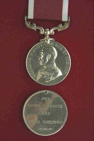 Long Service and Good Conduct (Army) Medal.  A circular, silver medal, 1.42 inches in diameter.