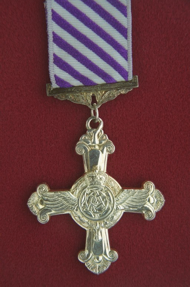 Distinguished Flying Cross.  A cross flory, 2.125 inches wide, with the horizontal and base bars terminated with bumps, the upper bar with a rose.
