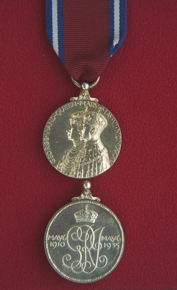 King George V Silver Jubilee Medal (1935).  A circular, silver medal (1.25 inches in diameter).