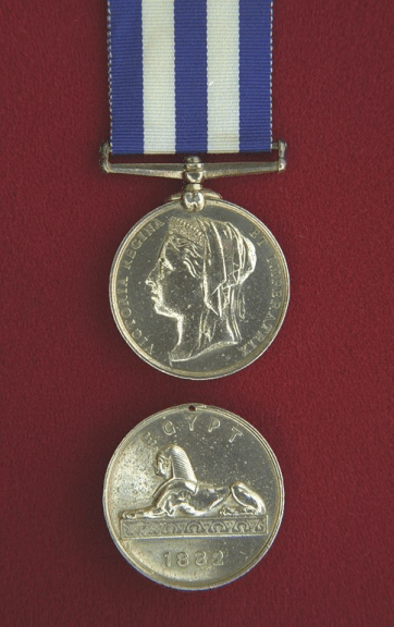 Egypt Medal. A circular, silver medal, 1.42 inches in diameter.