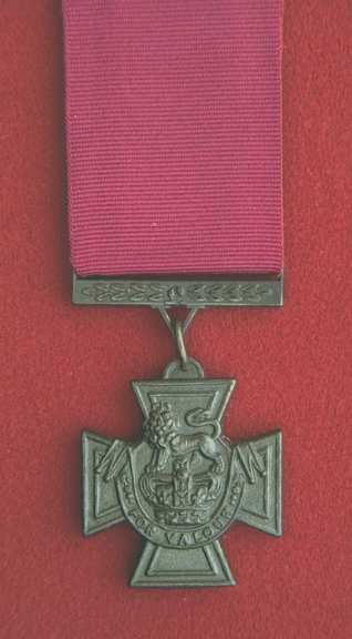 Victoria Cross.  A cross pattee, 1.375 inches across, with a dark brown finish.