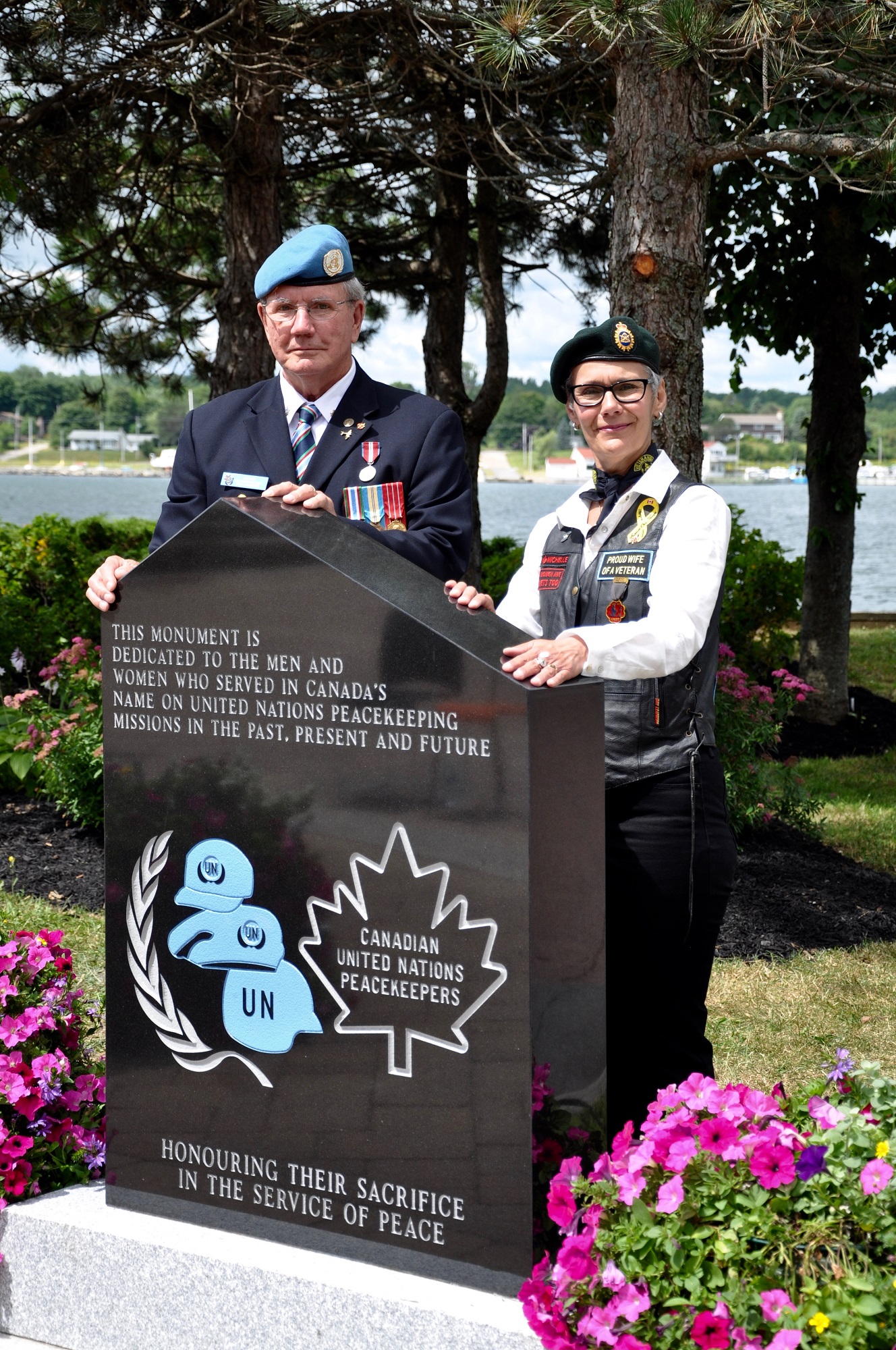 Designer Michele Gardiner and her husband peacekeeping Veteran Don Gardiner with the Peacekeepers Monument.