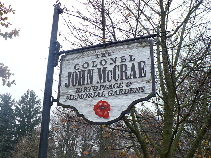 The Colonel John McCrae Birthplace & Memorial Gardens sign