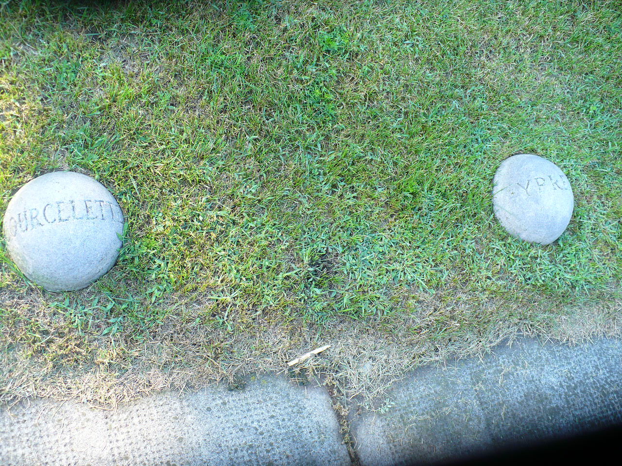 Concrete balls engraved with Courcellette and Ypres.