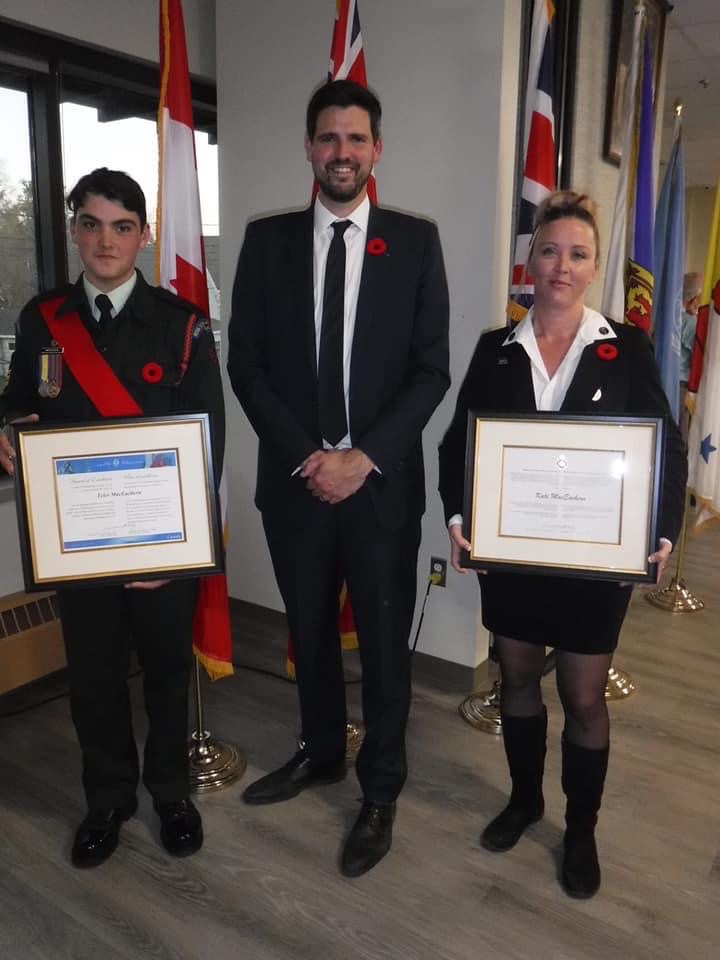 Kate MaEachern and her son Tyler both receive awards for their volunteer involvements. They are pictured here with Antigonish MP Sean Fraser.