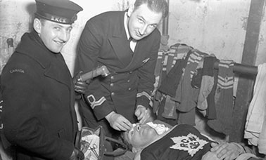 defenceman with the Royal Canadian Navy hockey team, injured during a game