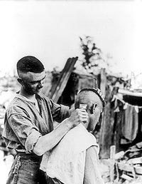 A Canadian having a close shave near the front line.
