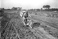 His Majesty's Pigeon Service. Dispatch Rider starting out with birds for service in the trenches, November 1917.