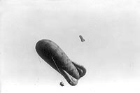 Two kite balloons in mid-air behind the Canadians, April 1917.