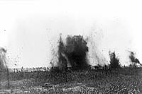Barbed wire being destroyed by trench mortars in No Man's Land.