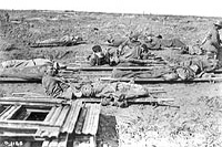 Stretcher cases waiting to be loaded on light railway. Vimy Ridge, April 1917.