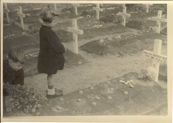Children laying flowers for a fallen Canadian.