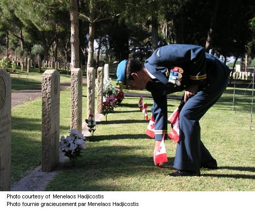 Captain Dan Zegarac planting the Canadian Flag